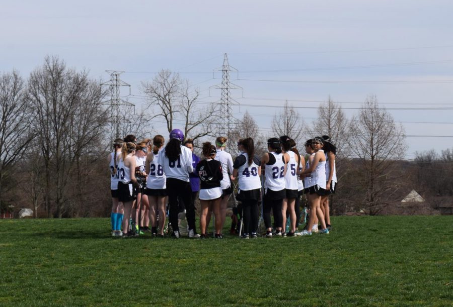 On April 1, 2018, Girls Lacrosse kicked off the season with their first home game against Oakville High School where they lost 12-0. The team huddles together before the start of the game and coaches offer words of encouragement to wish them luck during their game.