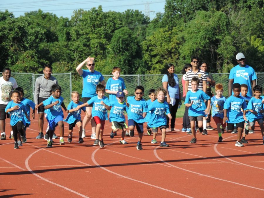 Mckelvey Kindergarten boys race towards the finish line during the 25m dash at the McKelvey Fun Run on Sept. 7. Boys and girls were required to run separately since there were so many participants in the event.