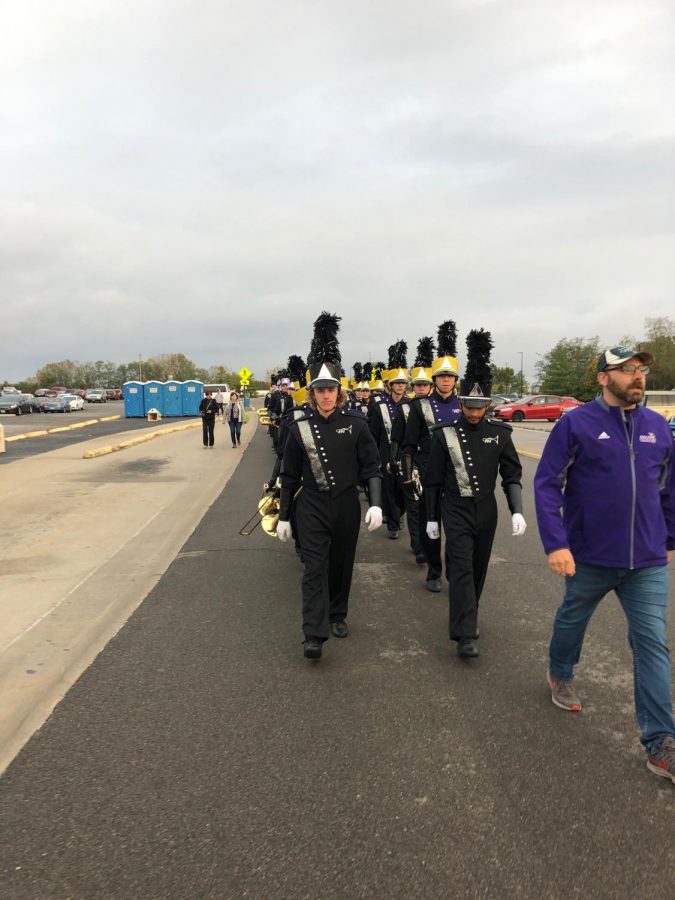 Students+of+the+PNH+band+line+up+and+march+into+their+final+competition+of+the+year+with+drum+major+senior+Logan+Boatright+and+junior+drum+major+junior+Keith+Pennel.+We+beat+Rolla+that+we+never+have+beaten+before%2C%E2%80%9D+said+Boatright.