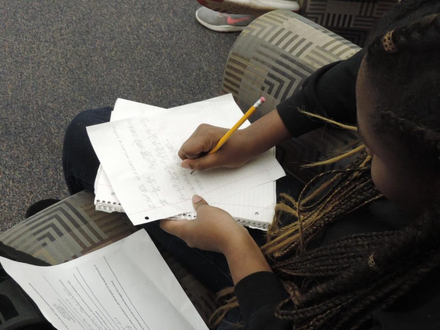 With the end of the semester just ten days away, students have been spending time keeping up in their classes while also studying for finals. Senior Caylah Johnson studies in the  library at North during first lunch. 