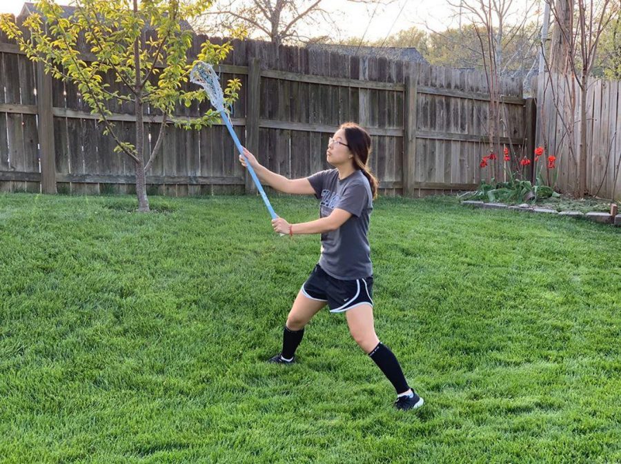 Junior Cherry Qiu practices her stick skills for lacrosse during quarantine. “It’s hard to practice by myself because I don’t have anyone to throw and catch with. I’m also trying to run during the week, but it’s honestly hard to find motivation sometimes.”