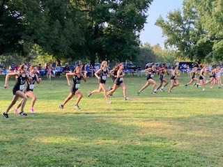 The girls cross country team takes off at McNair Park. North only raced against two teams, MICDS and John Burroughs, in order to keep a safe distance between the runners.