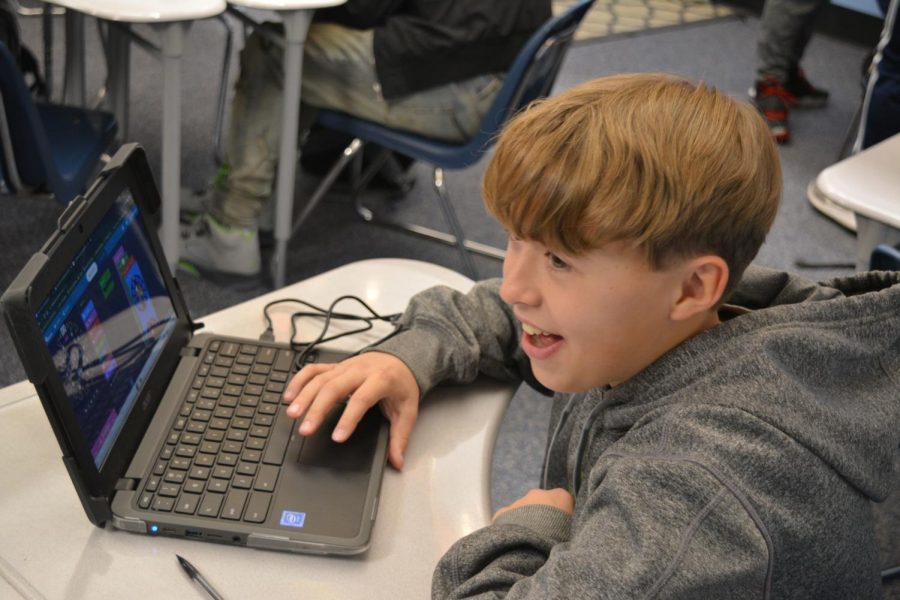 Sophomore Dominic Hudson has a good time learning how to code during the Computer Science Festival. Photo by Kennedy Williams 