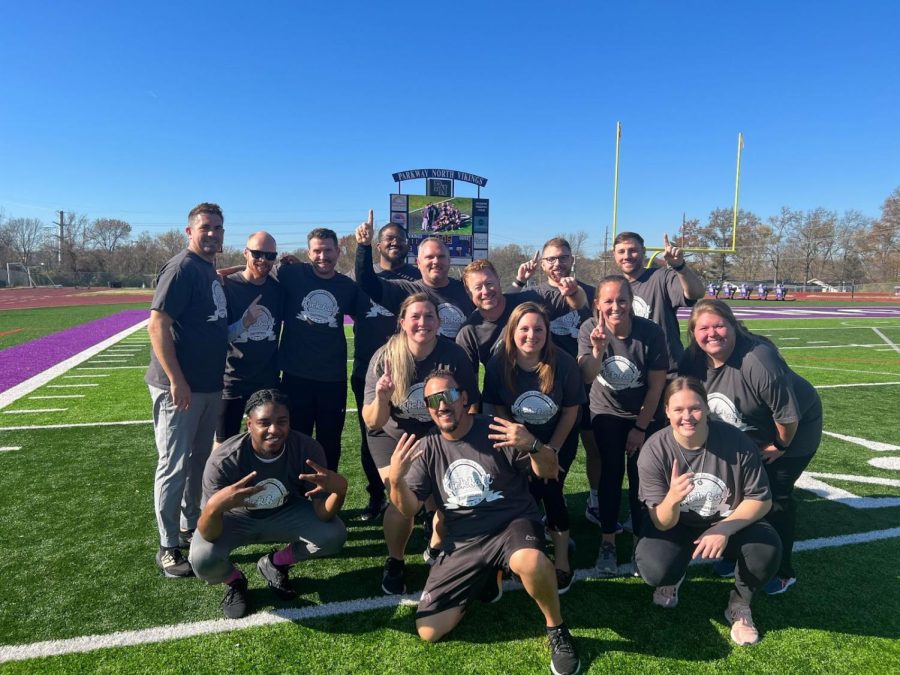 The staff celebrates after the 11-7 win over the students in the annual staff vs student kickball game. The game raised over $400 for Siteman Cancer Center. 