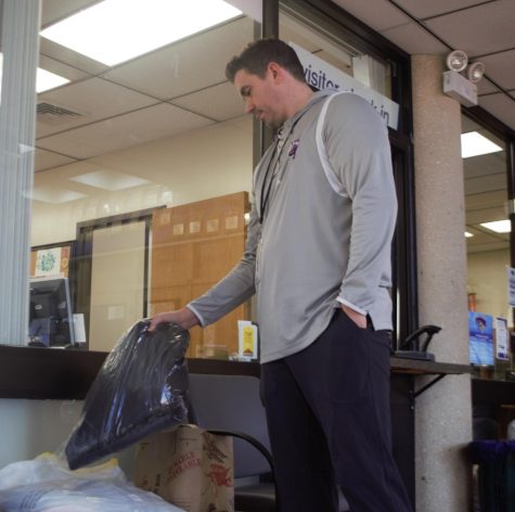 Athletic Director Josh Martin gives back to children in need by donating to the coat drive sponsored by the Parkway North Key Club. People who would like to donate can drop off their coats in the bins located in the commons near Mr. Jones office and outside of the athletics office.