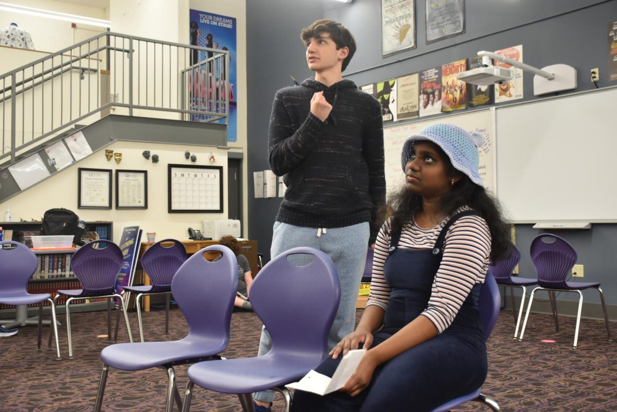 Junior Max Banashek and sophomore Felishya Robert Rajakumar rehearse a scene from “The Tale-Tell Farce”. The show requires exaggerated expressions and movements. Banashek has previously acted in four other shows at North, and this is Robert Rajakumar’s first time acting at North.
