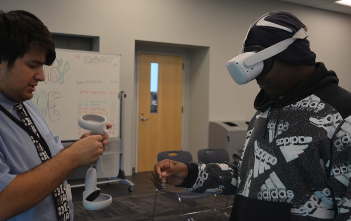 During Teentober, freshman Josiha Smith learns how to use the VR. The Saint Louis Libraries, including Thornhill across the street from school, are offering fun activities geared towards teens this month.
