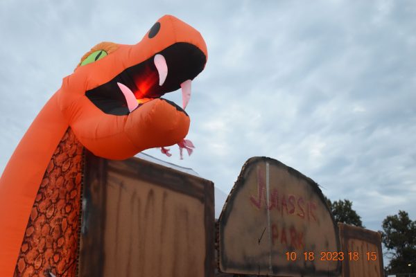 The Jurassic Park themed booth, sponsored by the PTO, was a favorite for participants. It had inflatable dinosaurs, a sign, and a bean bag toss game.