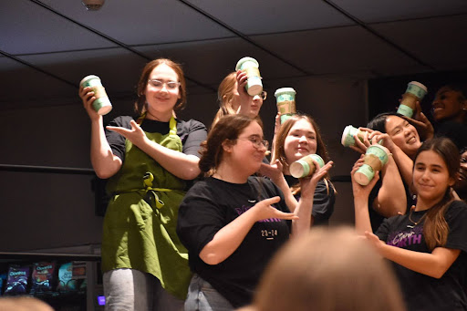 Juniors Samantha and Miranda Platke, Evie Blue, Isabelle Evri, Eva Jansen and senior Koo perform ‘Coffee in a Cardboard Cup’ at the Coffee House event on Dec. 14. All three choirs performed and Northern Lights sold homemade goods to benefit the Choir’s New York trip in the spring.