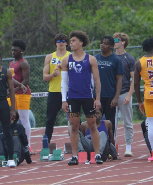 Junior Jordan Morgens-Clark  preps himself to run his first race: the 100 meter dash. This is the team’s first home meet of the season. Clark also plays football and loves the adrenaline rush of a competition. Clark has been doing track since his freshman year and still loves it to this day.