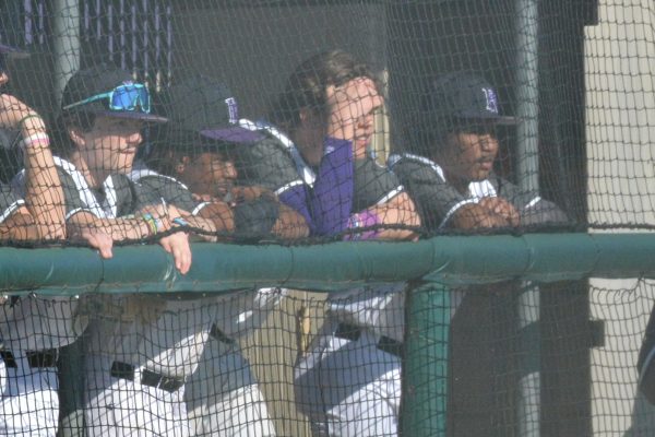 Players hangout in the dugout at one of the last games of the year, watching and hoping for a win. The team went 3-21 this year but learned a lot and is hopeful for next year.