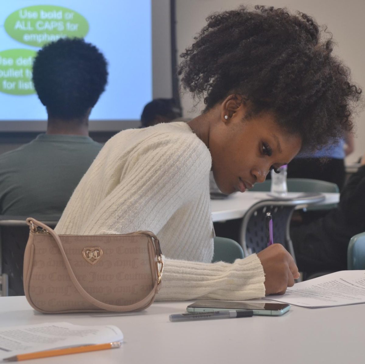 Senior and Spark! Bioscience associate Kezi’Ana Harris reviews the handout from the resume workshop on Sept. 20. “The resume workshop was useful for scholarships, internships, jobs and so much more,” Harris said.