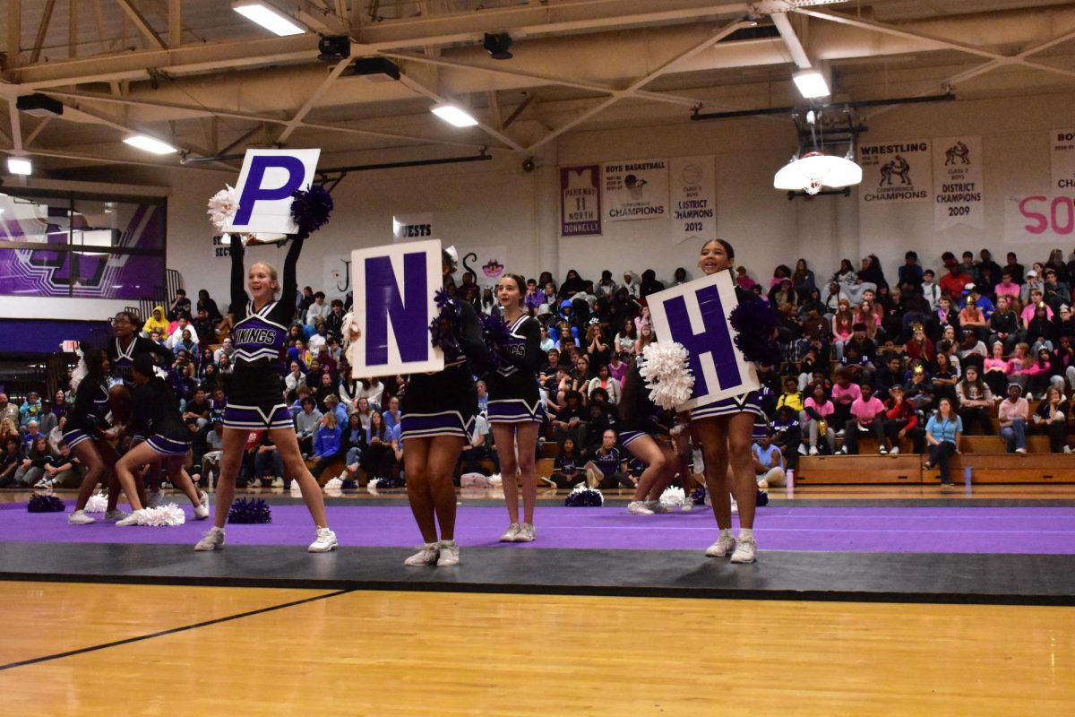 JV cheerleaders get the crowd riled up by including them in their routine chant. It was a great way to get students ready for the homecoming football game and dance that weekend.