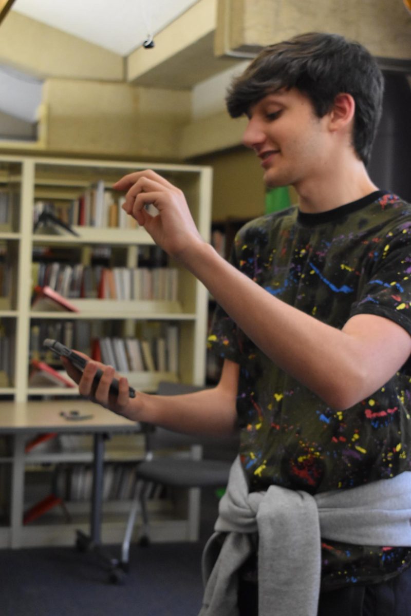 Senior Maxwell Banashek, energetically recites his poem for the poetry slam audience. “Usually I am more of a keep [poetry] private kind of guy because I’m waiting for the right time and place… poetry slams are the kind of nice, safe place for me to perform my poems.”
