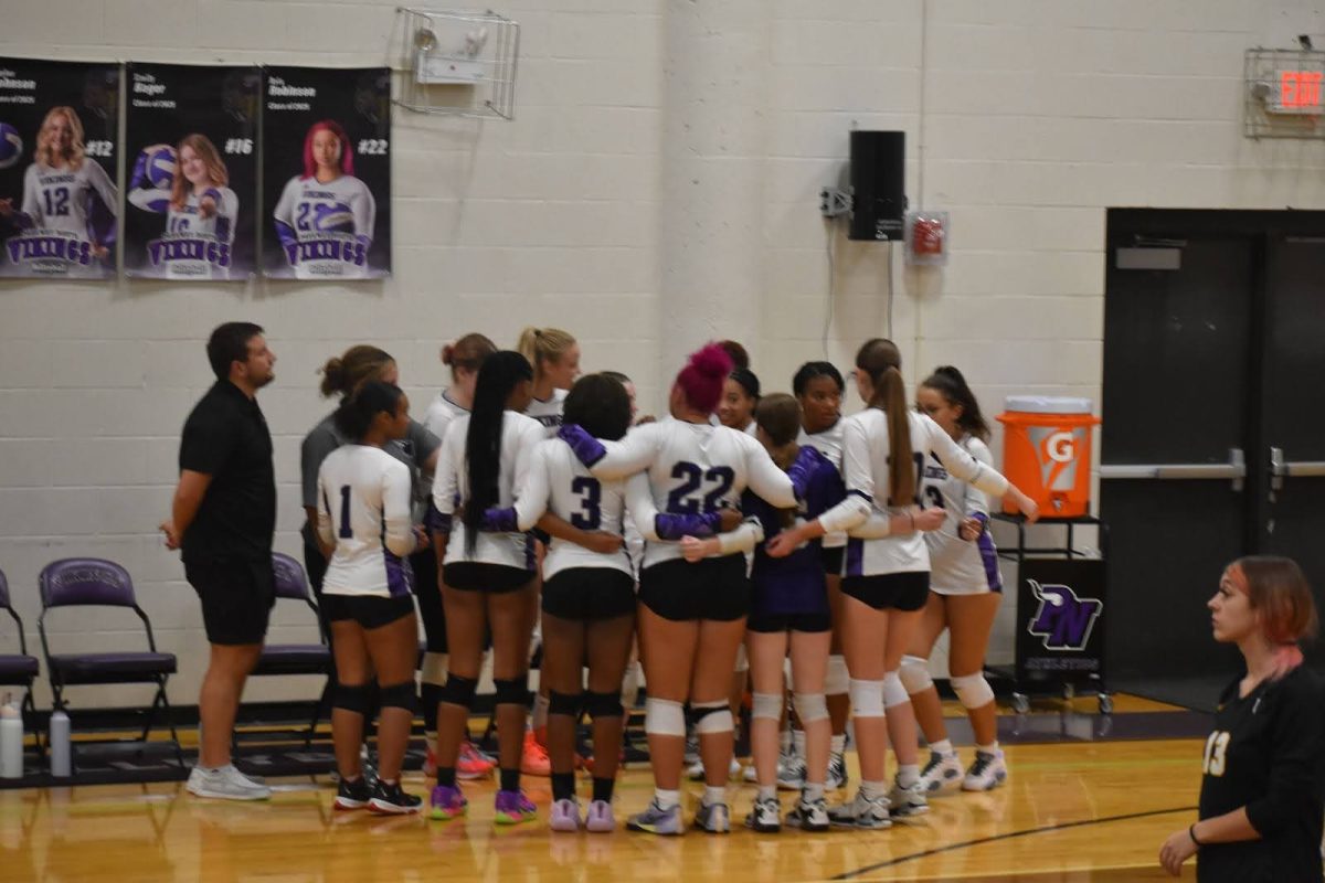 New volleyball coach Westin Roy rallies North's volleyball team at the game against University City. Roy believes respect is key to having a good team.