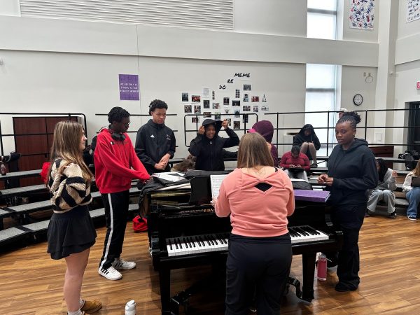 Choir Director Kimberly Roback works with a small group ensemble for the upcoming contest during class. "We have six ensembles this year, and there's a lot of kids doing solos. With all the snow days, it's been hard this year. There's a lot more pressure." Roback said, "Everybody feels behind, and it's not necessarily everyone's fault. So fingers crossed."