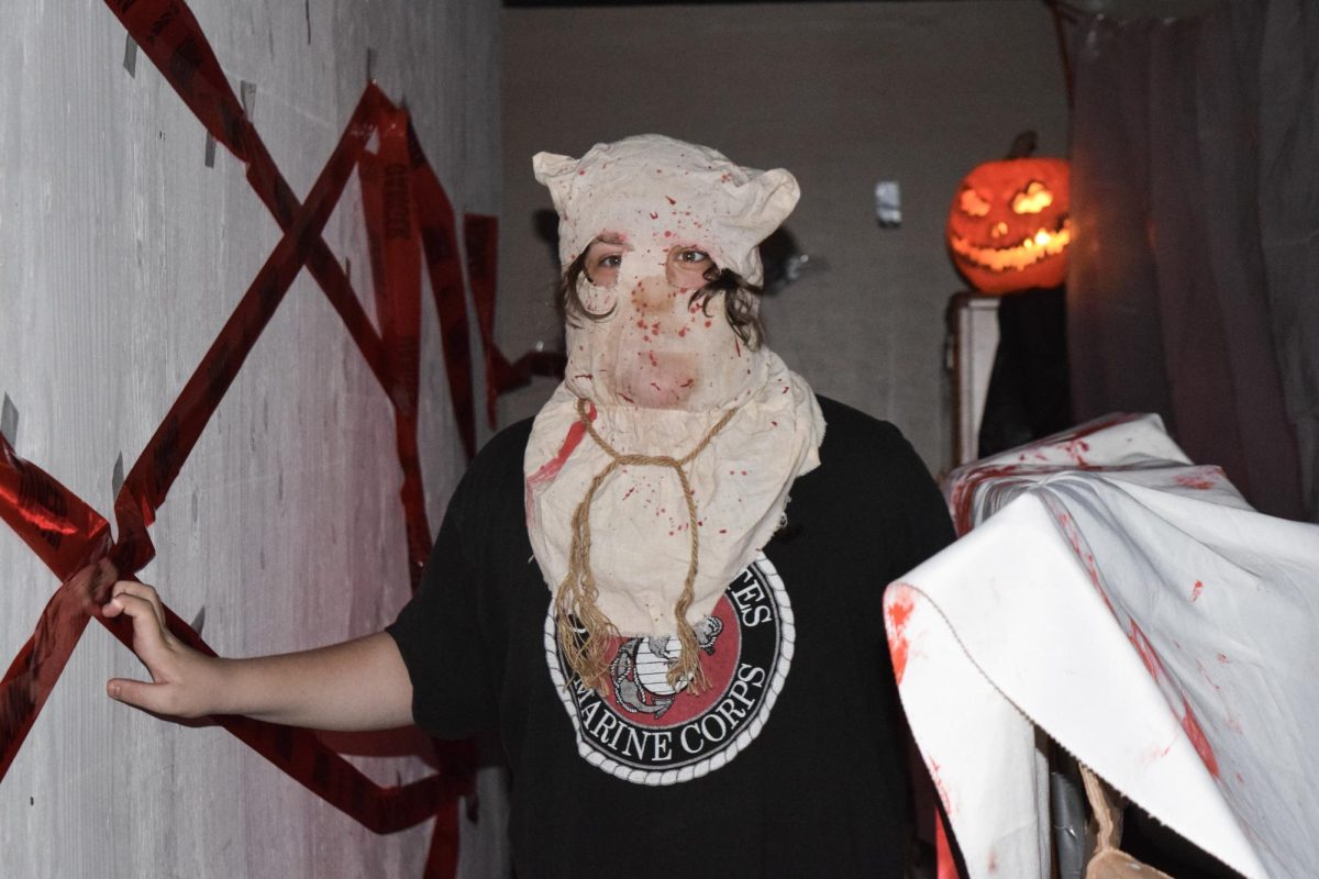 Sophomore Nova Berger frightens their peers as a scare actor in the Haunted Hallway. The hallway was elaborately decorated with fake bodies, skeletons, bones, and other props, and had detailed costumes as well. Teachers spent time during their plan periods, after school, and more to set up.